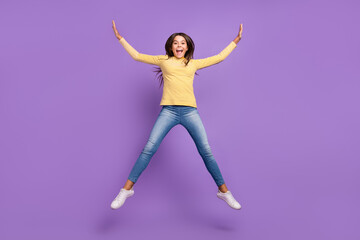 Full size photo of young excited cheerful girl have fun energetic jump isolated over violet color background