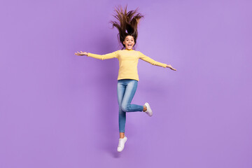 Fototapeta na wymiar Full body photo of young lovely girl jump up wear casual clothes dream active isolated over violet color background