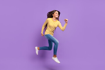 Full size profile side photo of youth lady run speed motion active look empty space isolated over violet color background