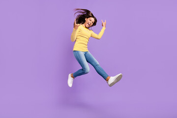 Fototapeta na wymiar Full body profile side photo of youth excited girl show fingers horns symbol rude isolated over purple color background