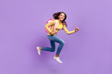 Fototapeta na wymiar Full body profile side photo of youth lady scholar backpack jump run fast lesson isolated over purple color background