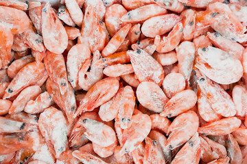 Frozen shrimp in supermarket. Sale of seafood. Eco-friendly organic food.