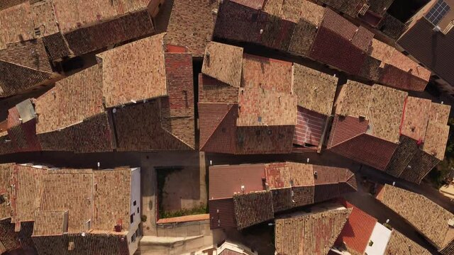 Vertical drone view over a small village rooftops in Spain
