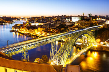 Porto Portugal with bridge Ponte Dom Luis I Douro river town travel at twilight