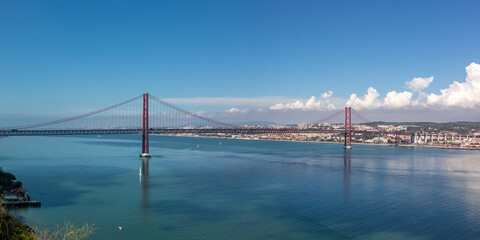 Lisbon Portugal bridge Ponte 25 de Abril over Tejo river panorama town travel