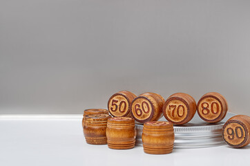 wooden barrels with numbers on a silver background