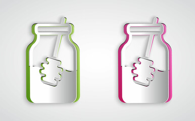 Paper cut Jar of honey and honey dipper stick icon isolated on grey background. Food bank. Sweet natural food symbol. Honey ladle. Paper art style. Vector