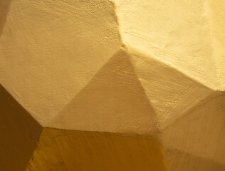 Abstract of gold color on cement textured and background.