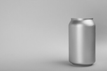 Can of energy drink on light grey background. Space for text