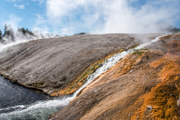 A little stream of hot water flowing in a natural pool, Yellowstone NP