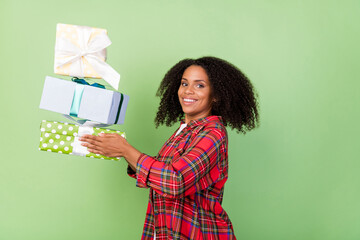 Profile side photo of young lovely african woman receive gift box event isolated over green color background