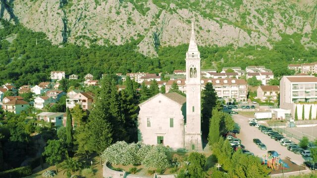 Aerial view of the village of Dobrota and St. Eustace's Church. Montenegro. Aerial drone view 4K.