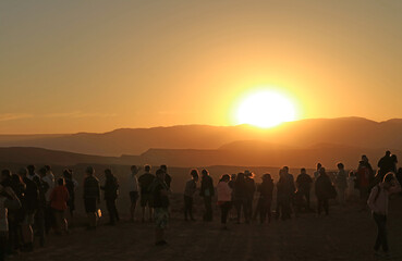 Silhouette of Many Visitors on the Cliff Watching the Scenery Sunset at Valle de la Luna in Atacama Desert, Los Flamencos National Reserve, Northern Chile