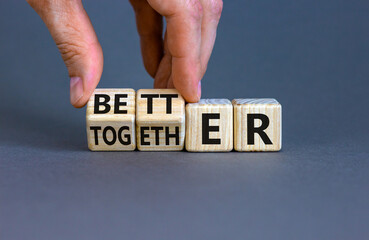 Better together symbol. Businessman turns cubes and changes the word together to better. Beautiful...