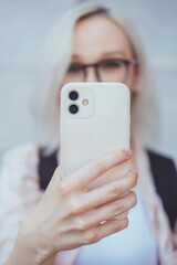 Young beauty girl purple hair make selfie on smartphone, happy face, outdoor hipster portrait on...