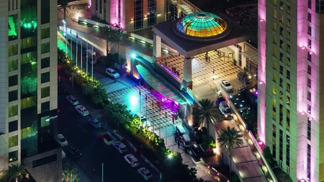 night illumination dubai famous hotel intrance roof top view 4k time lapse uae