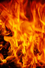 Fire background as symbol of hell and eternal pain. Vertical image.