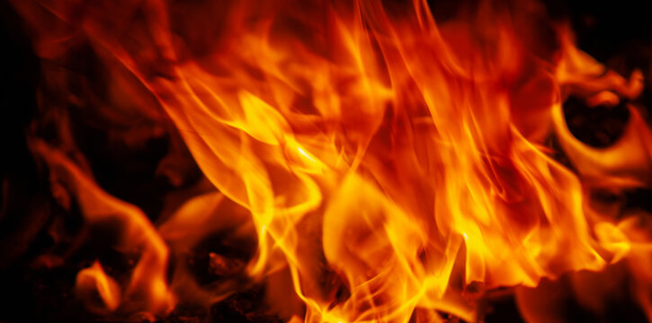 Fire background as symbol of hell and eternal pain. Free copy space for design. Vertical image.