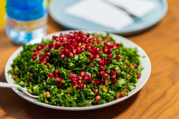 Tabbouleh is a Levantine salad made mostly of finely chopped parsley Tabbouleh Chopped Parsley Tabouli Syrian Salad, lebanese salad, turkish salad. High quality photo