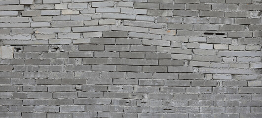 gray wall of brick blocks