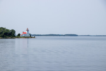 Little Current, Ontario, Canada - July 26, 2021: Lighthouse at Little Current, Ontario on a calm summer day