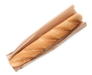 Tasty baguette and package isolated on white, top view. Fresh bread
