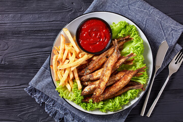 crispy fried capelin with lettuce, french fries