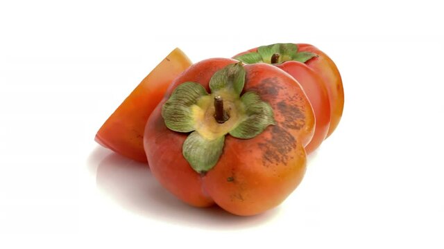 sliced persimmon isolated on white background