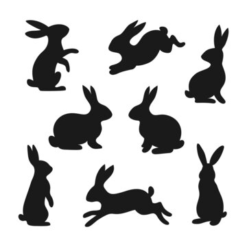Set of 8 black rabbits, hares, bunnies. Vector illustration in flat style is isolated on white background.