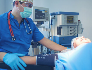 Man surgeon at work in operating room