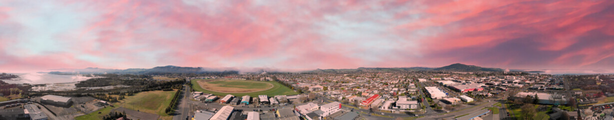 Fototapeta premium Panoramic aerial view of Rotorua landscape and geysers smoke, New Zealand from drone