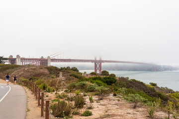 Fototapeta premium Scenic Golden Gate Bridge in the fog from Fort Poin, San Francisco