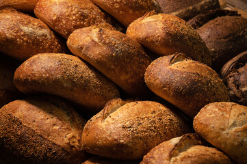 Craft loaves of bread. Fresh hot bread from the oven. Appetizing and healthy food