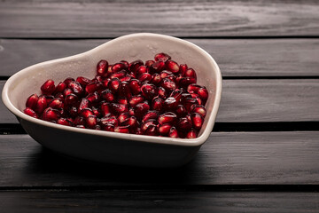 grains garnet in dish on black