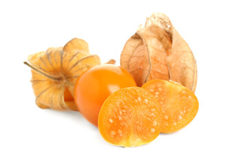 Cut and whole physalis fruits with dry husk on white background