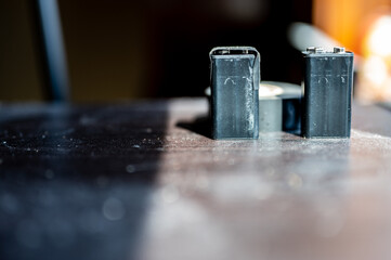 9 volt dead battery with terminals covered with electrical tape for safety 