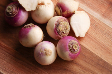 Purple Baby turnips on a wooden board