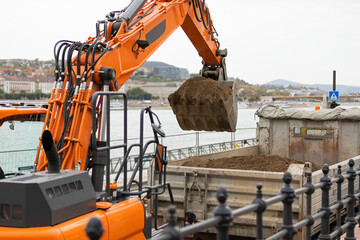 Excavator on urban street