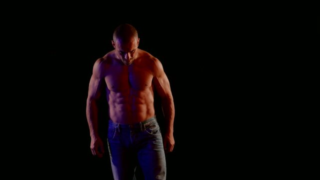middle-aged man with muscular naked torso, washboard abs and strong arms
