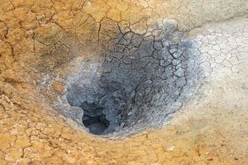 Naklejka premium Boiled mud thermal cater in Uzon - a volcanic caldera, Kamchatka Peninsula, Russia