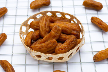 Sun-dried bananas on white background.