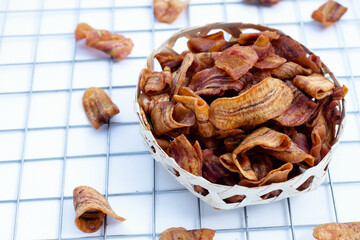 Banana slice chips on white background.