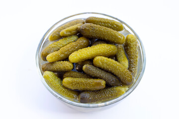 Pickled gherkins or cucumbers on white background.