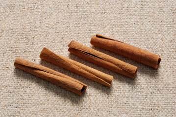 Cinnamon sticks on a linen fabric