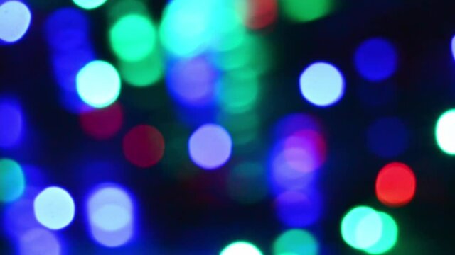 Urban night light blur bokeh defocused background. Blurr out of focus. Magical fairy festive Christmas backdrop. City scape at evening.