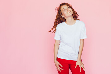 Smiling woman with red curly hair in white t-shirt. Mock-up.