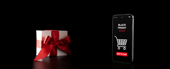 Black Friday banner with internet online shopping app on mobile phone, white gifts with red bow falling on black discount background.