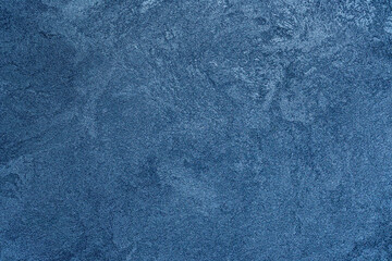 Textured blue background. Decorative plaster walls, wallpaper. Blue winter texture