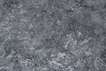 Textured dark background. Decorative plaster walls, wallpaper. Black texture decorative plaster walls