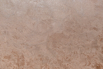 Textured background. Decorative plaster walls, external decoration of facade. Texture of beige, pink.